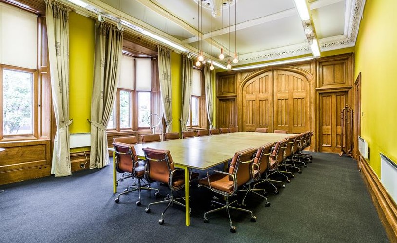 Table and chairs set up in meeting room at the Engine Shed